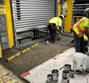 B&B Concrete employees in yellow safety vets inspect their worksite